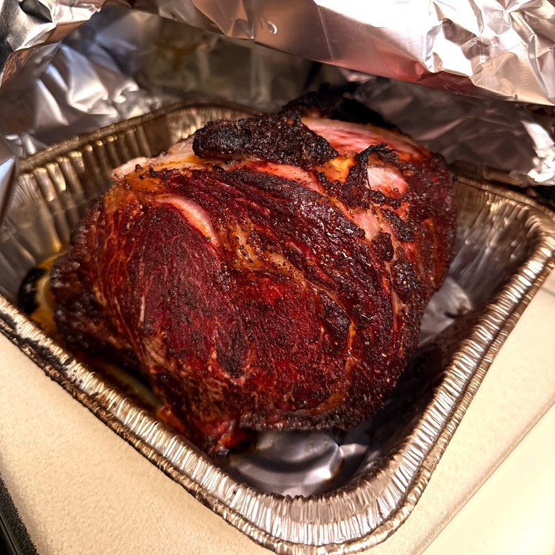 Smoked prime rib in a foil pan